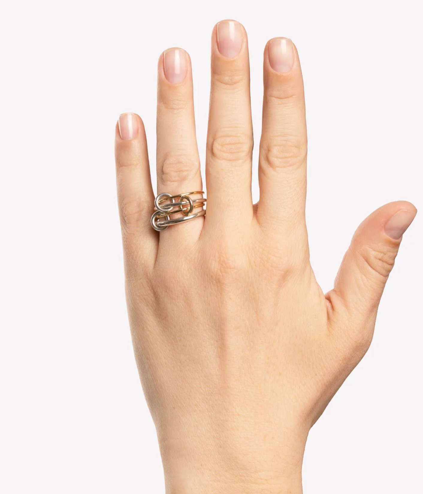 Spinelli Kilcollin Pisces SG Ring worn on hand, showing linked sterling silver and 18K yellow gold bands