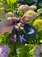 Personalized leather keyring bag charm with a hand-painted monogram — Cou